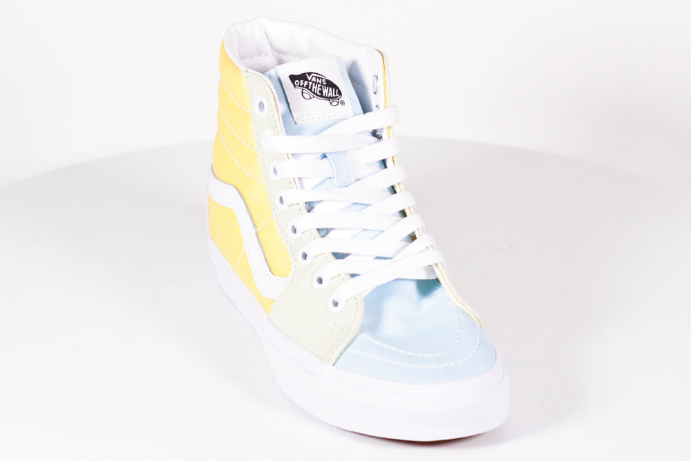 blue and yellow high top vans